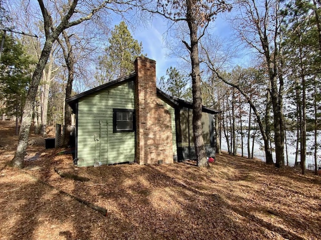 view of side of property featuring a chimney