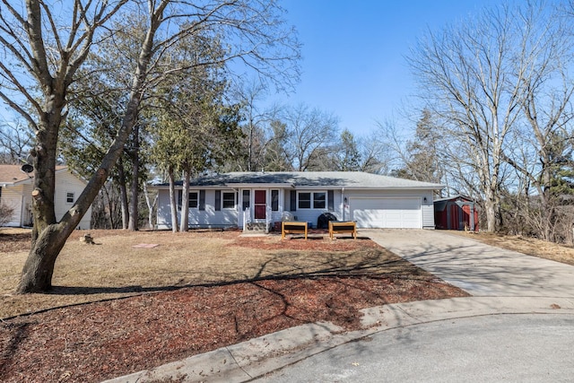 ranch-style house with an attached garage and concrete driveway