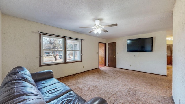 unfurnished living room featuring a textured ceiling, carpet, a ceiling fan, and a textured wall