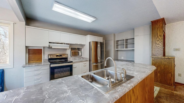 kitchen featuring a sink, under cabinet range hood, appliances with stainless steel finishes, white cabinetry, and open shelves