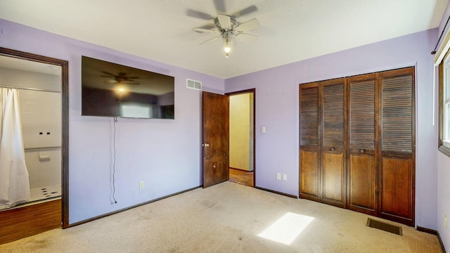 unfurnished bedroom featuring a closet, baseboards, visible vents, and carpet floors