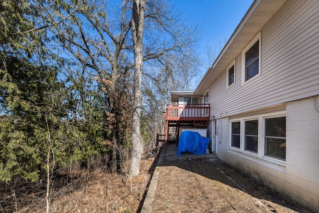 view of yard featuring a deck and stairs