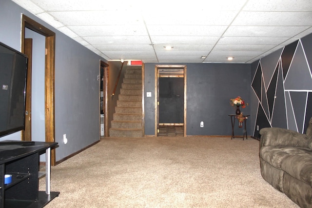 carpeted living room featuring stairway, a paneled ceiling, and baseboards