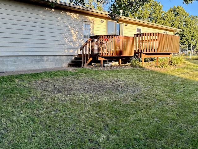 exterior space with a yard and a wooden deck