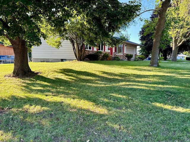 view of yard featuring an attached garage