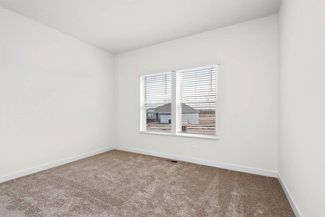 18746 Ivanhoe St NW, Elk River, MN 55330 - carpeted spare room with baseboards