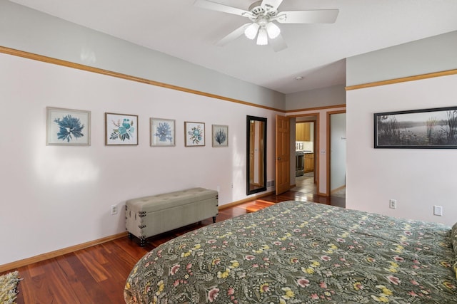 bedroom featuring a ceiling fan, wood finished floors, and baseboards