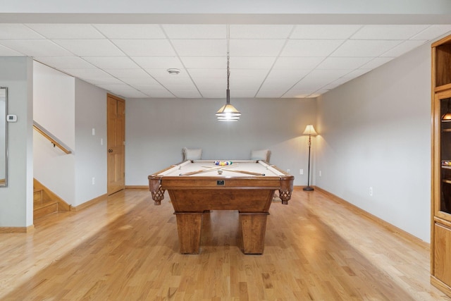 playroom with pool table, a paneled ceiling, baseboards, and light wood finished floors