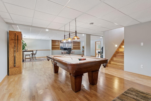 playroom featuring a drop ceiling, billiards, and light wood finished floors