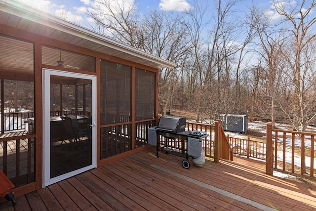 wooden terrace featuring area for grilling and a sunroom