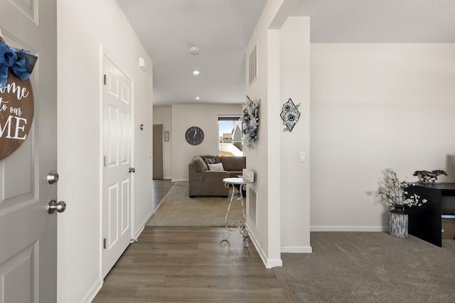 hall with recessed lighting, wood finished floors, and baseboards