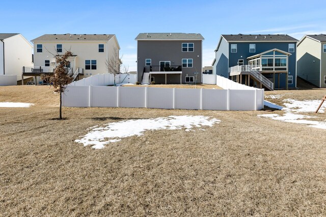 view of yard with stairs and fence