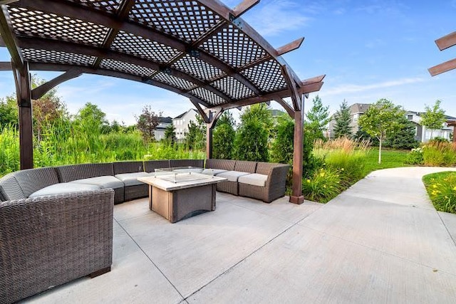 view of patio / terrace featuring an outdoor living space with a fire pit and a pergola