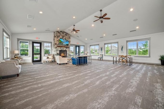 unfurnished living room featuring visible vents, baseboards, recessed lighting, a fireplace, and high vaulted ceiling