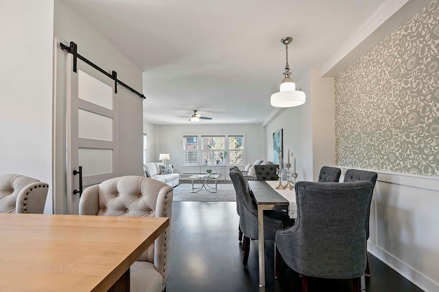 79 Western Ave N Unit 308, Saint Paul, MN 55102 - dining space featuring a barn door and a ceiling fan