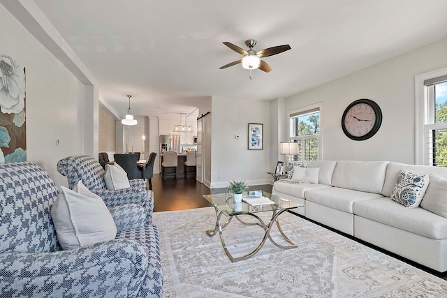 79 Western Ave N Unit 308, Saint Paul, MN 55102 - living room featuring ceiling fan, wood finished floors, and baseboards
