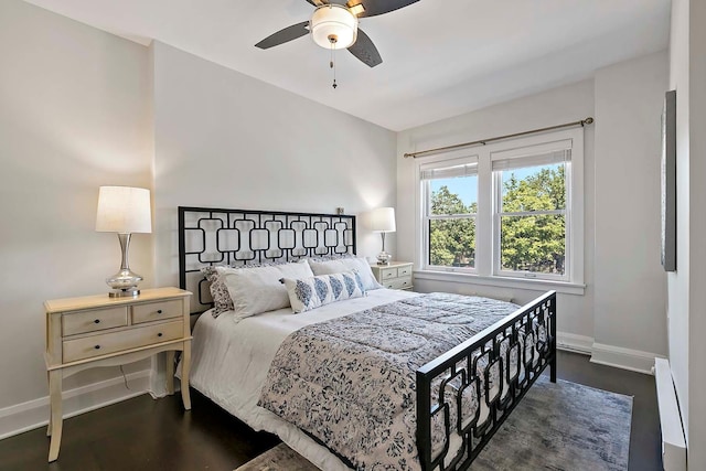 79 Western Ave N Unit 308, Saint Paul, MN 55102 - bedroom featuring baseboards, dark wood-style floors, a baseboard radiator, and ceiling fan