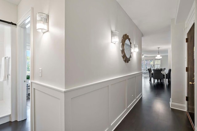 79 Western Ave N Unit 308, Saint Paul, MN 55102 - corridor with dark wood-style floors and a barn door