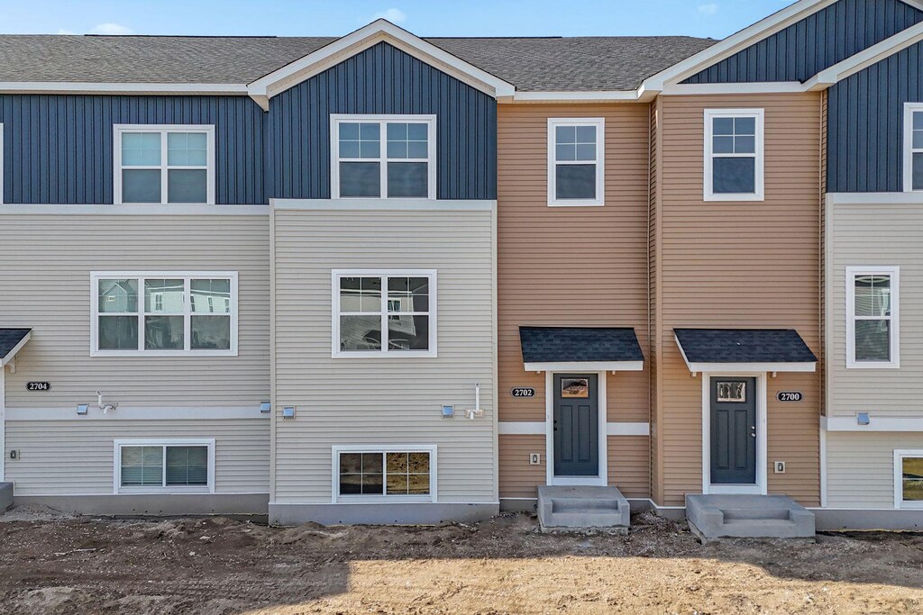 2702 Kepler Ave NE, Saint Michael, MN 55376 - townhome / multi-family property with entry steps and board and batten siding