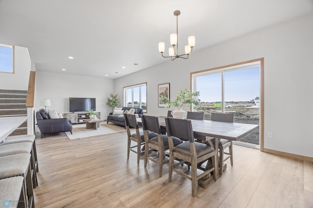 dining room with stairway, recessed lighting, light wood-type flooring, and a notable chandelier