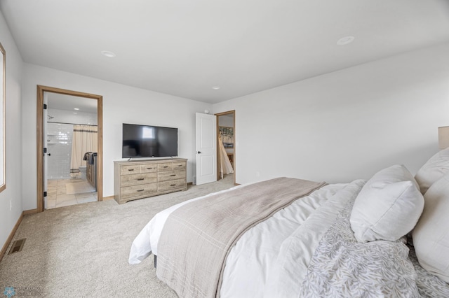 bedroom featuring visible vents, connected bathroom, baseboards, and light colored carpet