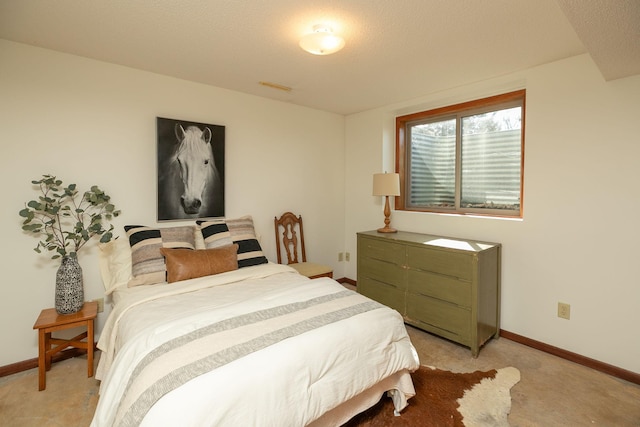 bedroom with light carpet, visible vents, and baseboards