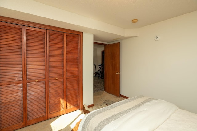 bedroom featuring a closet and light carpet