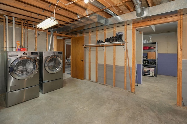 unfinished basement featuring washer and clothes dryer