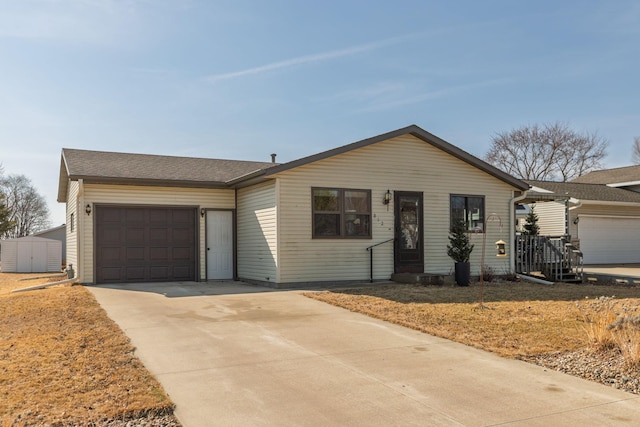 ranch-style home with driveway and an attached garage