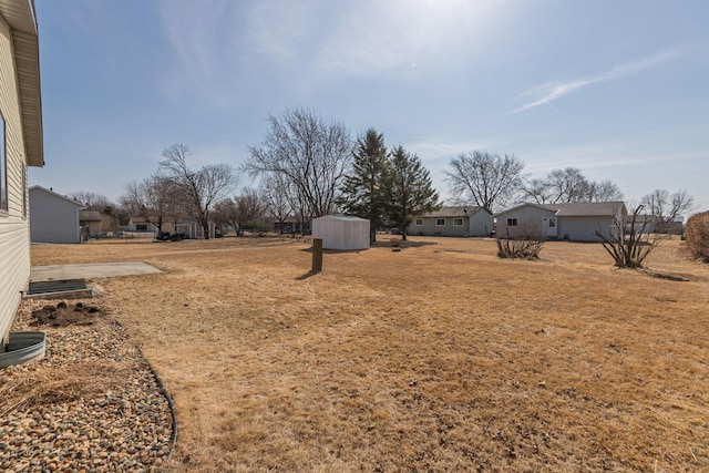 view of yard with a shed and an outdoor structure