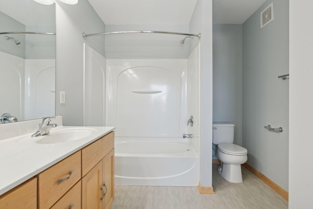 full bath featuring vanity, washtub / shower combination, visible vents, baseboards, and toilet