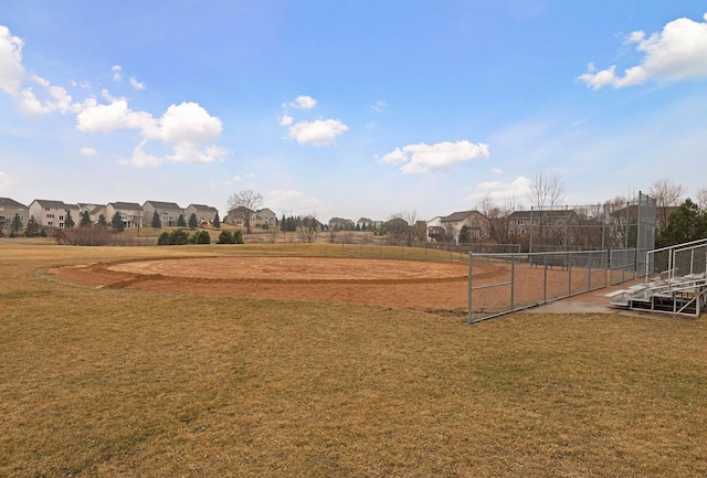 view of yard with a residential view and fence