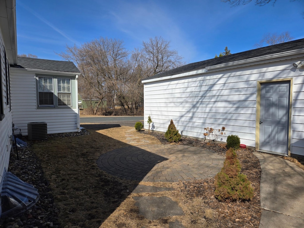 view of yard featuring cooling unit and a patio area