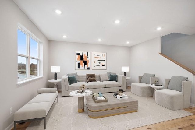 living area with recessed lighting, baseboards, and wood finished floors