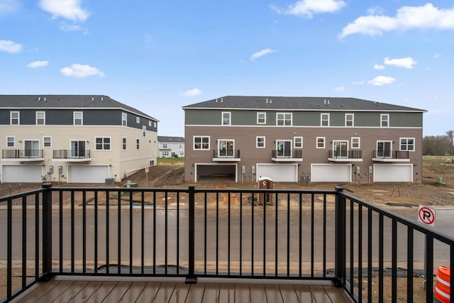 wooden deck with a residential view
