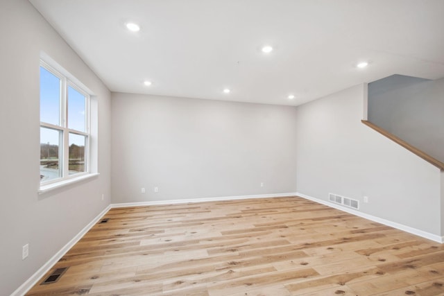 interior space featuring light wood-style floors, recessed lighting, and visible vents