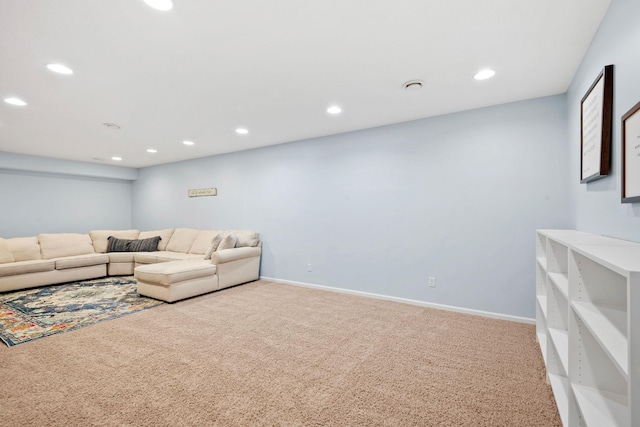 carpeted living area with recessed lighting and baseboards