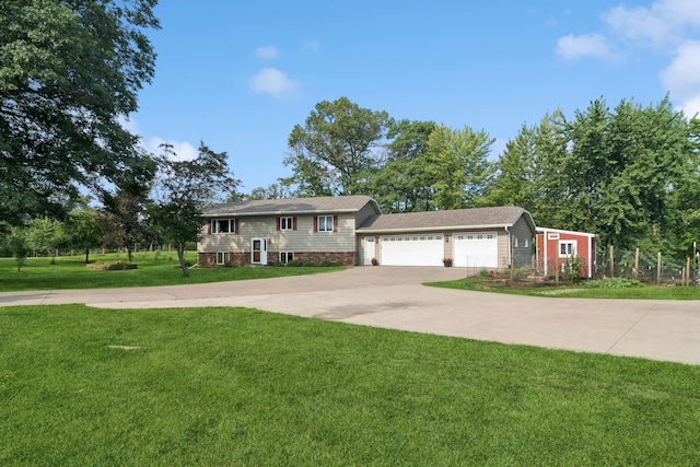 view of front of home with a front yard and driveway