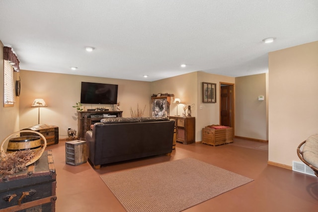 living area with recessed lighting, baseboards, and a fireplace