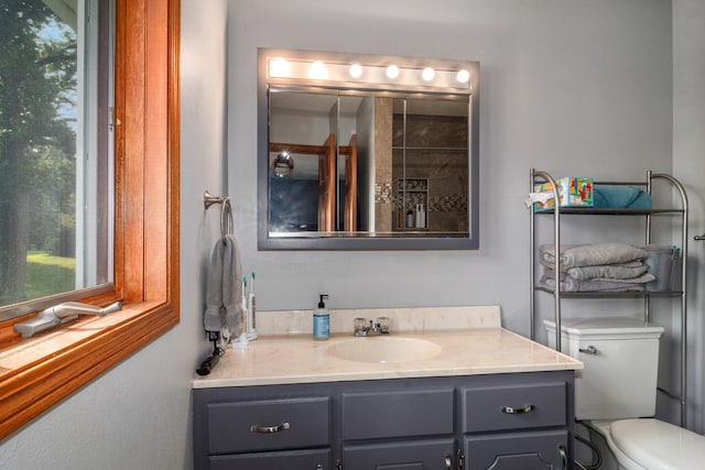 bathroom featuring vanity and toilet