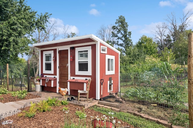 view of poultry coop featuring fence