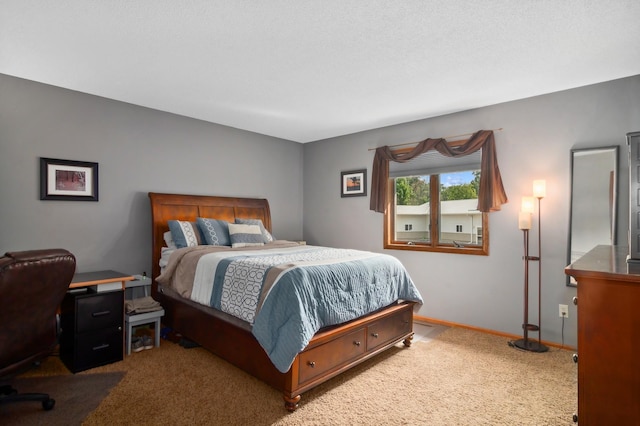 carpeted bedroom featuring baseboards