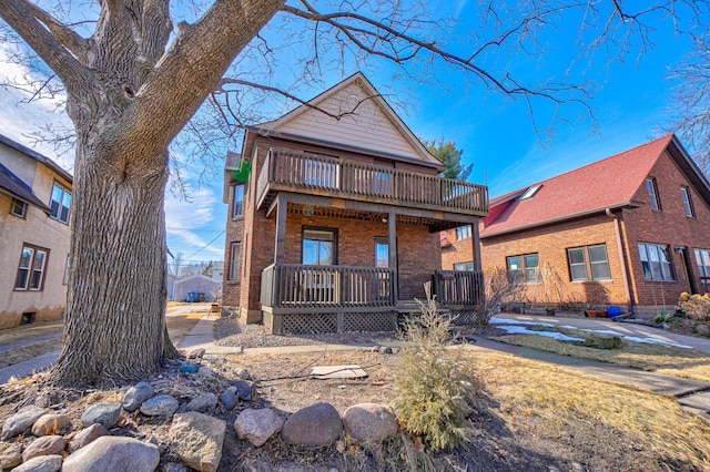 view of front of house featuring a porch and brick siding