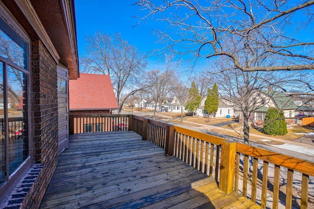 wooden terrace featuring a residential view