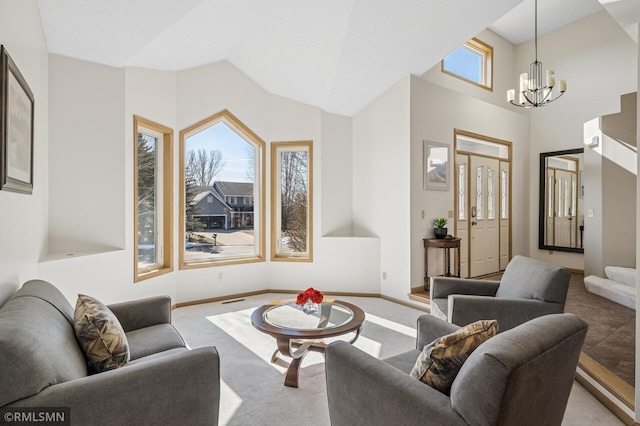 living area with baseboards, light carpet, lofted ceiling, and an inviting chandelier