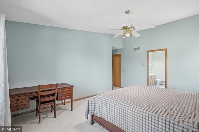 bedroom featuring baseboards, visible vents, vaulted ceiling, light carpet, and connected bathroom