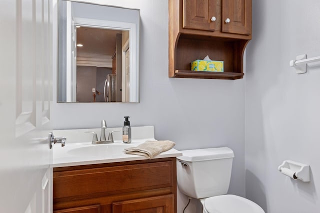 bathroom with toilet and vanity