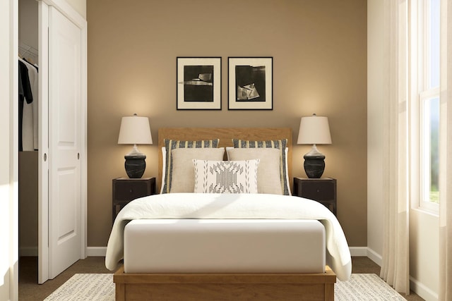 carpeted bedroom featuring baseboards