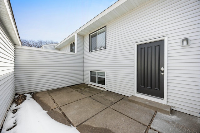 entrance to property with a patio