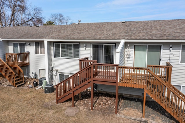 back of house with a wooden deck, stairway, cooling unit, and a shingled roof